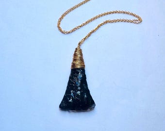 Stylized obsidian axe-head pendant wrapped in gold-filled wire and with and 18 inch gold-filled chain