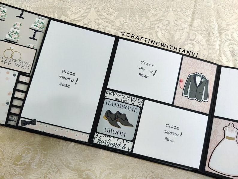 May include: A black and white wedding scrapbook with a white background and black borders. The scrapbook has several pages with different designs, including a pair of rings, a bow tie, a suit, a dress, and a pair of shoes. The text "Place Photo Here!" is written on several pages.