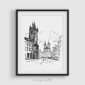 May include: Black and white ink drawing of a European city street scene, framed in a black border. The artwork depicts a tall clock tower, buildings, and a street with people. The artist's signature, "EdenStudioHK", is in the lower right corner.