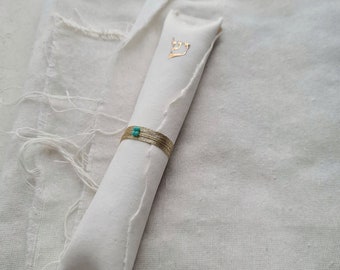 Handmade porcelain mezuzah case with gold thread and blue beads, made in Israel. Gift for a Jewish housewarming, wedding and Jewish holidays