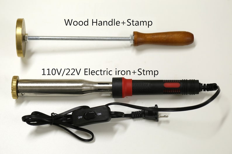 May include: Two tools for stamping metal. The top tool is a wooden handle with a metal stamp attached. The bottom tool is an electric iron with a metal stamp attached. The electric iron has an on/off switch and a power cord.