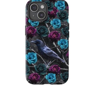 May include: A black phone case with a design of blue and purple roses and a black crow. The case has a camera cutout.