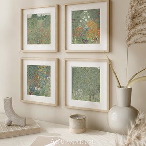May include: Four framed art prints featuring floral and landscape scenes. The prints are in light wood frames with white mounts. The artwork displays a range of colours, including green, red, yellow, and blue. The word "AQUAMARINE" is printed at the bottom.