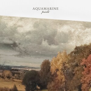 May include: An antique-style landscape print featuring a cloudy sky and a field with trees in autumn colors. The print has a vintage aesthetic, with the text "AQUAMARINE prints" in the upper left corner.