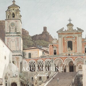 May include: A painting of a Mediterranean town square featuring a tall bell tower, a church with a peach-colored facade, and a wide stone staircase. The text AQUAMARINE prints is centered in white. A rocky mountain with a ruin sits in the background.
