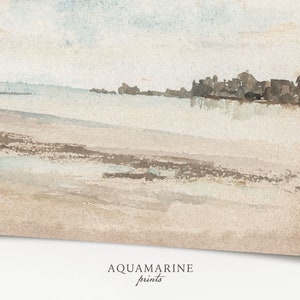 May include: Watercolor painting of a beach scene with a light blue sky and sandy shore. The artwork features soft, muted tones of beige, brown, and blue. The text "AQUAMARINE prints" is at the bottom.