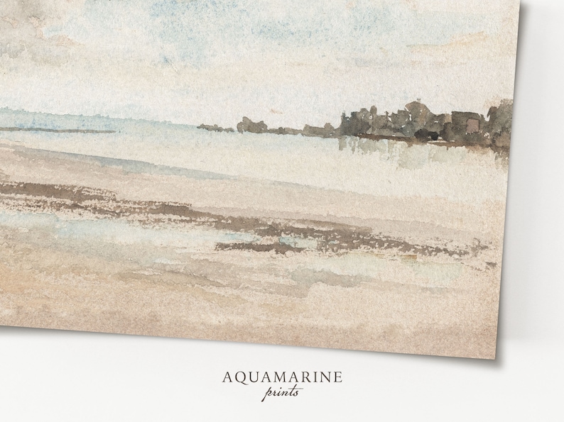 May include: Watercolor painting of a beach scene with a light blue sky and sandy shore. The artwork features soft, muted tones of beige, brown, and blue. The text "AQUAMARINE prints" is at the bottom.