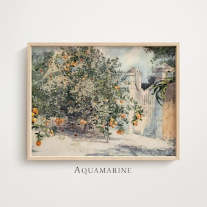 May include: A watercolour print depicting an orange tree with ripe fruit, a white picket fence, and a stone wall. The artwork is framed in a light wood frame. The word "AQUAMARINE" is printed at the bottom.