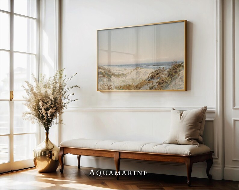 Vintage watercolor seascape showing sandy coastal dunes overlooking a calm sea under a soft sky. The artwork features delicate brushstrokes, muted natural tones, and subtle paper texture typical of antique illustrations, creating a serene and atmospheric coastal landscape ideal for classic or coastal wall decor.