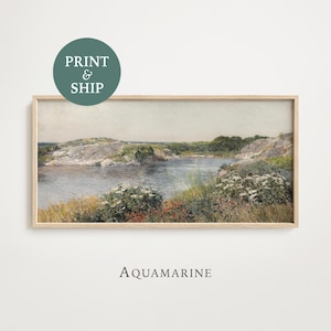 May include: Framed landscape art print featuring a serene coastal scene with a body of water, rocky shores, and lush greenery. The artwork is in a rectangular wooden frame. The text "Aquamarine" is below the frame, and a circular graphic reads "Print & Ship".