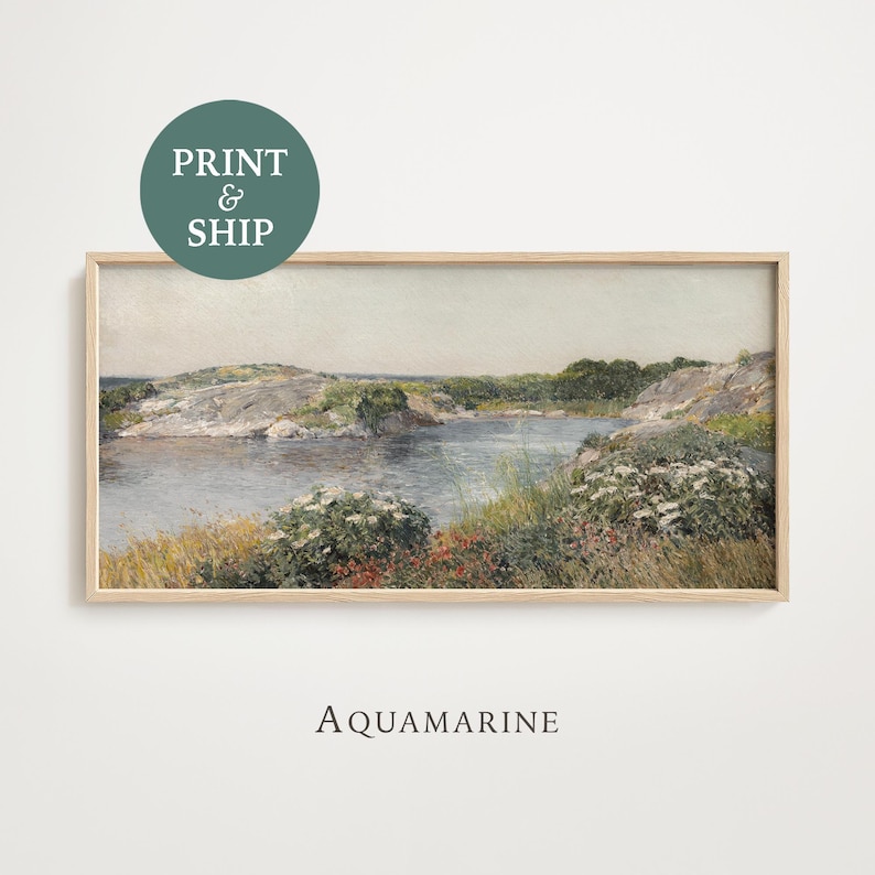 May include: Framed landscape art print featuring a serene coastal scene with a body of water, rocky shores, and lush greenery. The artwork is in a rectangular wooden frame. The text "Aquamarine" is below the frame, and a circular graphic reads "Print & Ship".
