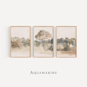 May include: Three framed landscape art prints, each with a watercolour painting of trees and forest scenes in muted beige, brown, and green tones. The word "AQUAMARINE" is printed below the frames.