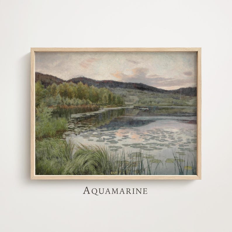 May include: A framed landscape painting depicting a tranquil lake scene with mountains in the background. The artwork shows a calm body of water with lily pads, verdant greenery, and a soft, muted colour palette. The word "AQUAMARINE" is printed at the bottom.