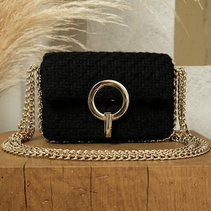 Black tweed handbag with chains
