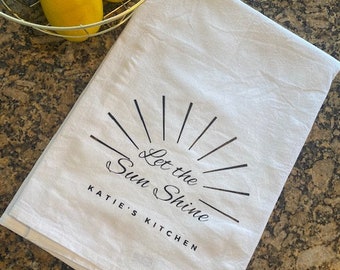 Deja que el sol tea towel