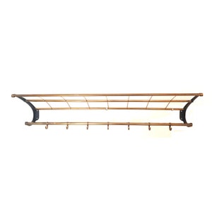 Mid-century wall coat rack with hat rack and seven hooks from the 1950s