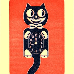 May include: A vintage-style wall clock shaped like a black cat with a white bow tie. The clock face is integrated into the cat's body, displaying the time. The background is a red rectangle on a yellow background.
