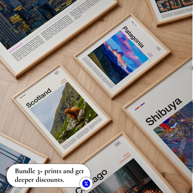 May include: A collection of framed prints with various travel destinations, including Scotland, Patagonia, and Shibuya. Each print features a photograph and text, with a light wood frame. The image also includes a promotional message.