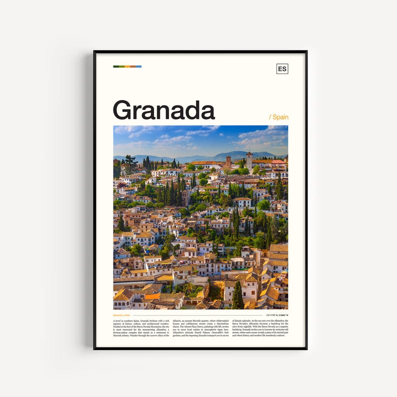 May include: A framed print featuring a scenic view of Granada, Spain, with white buildings and terracotta rooftops under a blue sky. The word "Granada" is displayed in large black text, with "Spain" below. The print has a black frame.