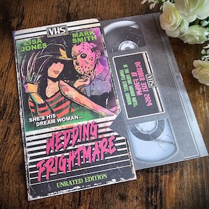 May include: A VHS tape invitation for a wedding with a horror theme. The front of the tape features a couple, the woman in a striped shirt and the man wearing a hockey mask. The text on the tape reads "Wedding Frightmare" and "Unrated Edition". The back of the tape includes the date and time of the wedding, "October 31st 2024 at 1:30pm", and the location, "At the Gothic Manor Hotel, Temple Street, London."
