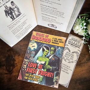 May include: A comic book cover featuring a black and white illustration of a monster bride and groom. The cover is titled "Tales of Horror!" and "Love at First Fright!" with the tagline "They were "made" for each other!"