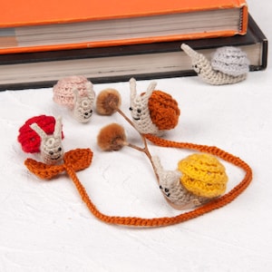 handmade crochet snail bookmark, amigurumi for booklovers, cute cottagecore animal plushie gift ideas