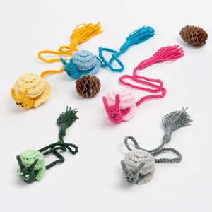 snail crochet bookmark, handmade amigurumi for booklovers, cute cottagecore animal plushie gift ideas