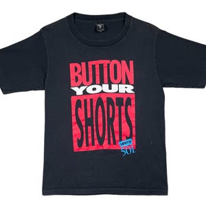 Camiseta promocional vintage de Levi’s 501 de los años 80/90 con el lema "Abrocha tus pantalones cortos" (Talla S/M)