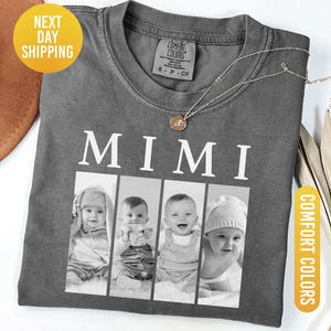 May include: Pepper-colored Comfort Colors t-shirt with the word "MIMI" printed in white. Below the word are four black and white photos of babies. A gold necklace and a brown hat are also visible.