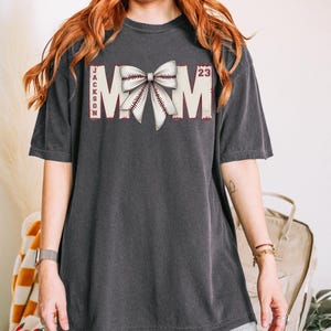 Custom Baseball Mom Shirt, Baseball Mom Shirt With Name, Coquette Baseball Bow Shirt, Baseball Mom Gift, Baseball Mom Shirt Number Game Day