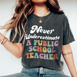Never Underestimate A Public School Teacher Kamala Harris Shirt, Harris Walz 2025 Rally Tee, Educator Shirt, Tim Walz DNC Quote Sweatshirt
