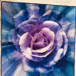 Excellent wall art. Quilt wall hanging of large purple rose flower, quilted  Dream Big Beautiful in many shades of purple. Lighter center