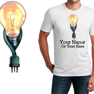 May include: White t-shirt with a graphic of a light bulb with a cord and plug. The text "Your Name Or Text Here" is printed below the graphic.