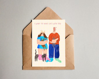 Puede incluir: Una tarjeta de felicitación con una ilustración de dibujos animados de dos personas que sostienen gatos. El texto de la tarjeta dice "Quiero tener gatos contigo."