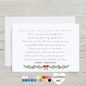 May include: A white card with a red and green holly border and a red bow. The card has a handwritten message that reads "Thinking of you and your mother this Christmas. Their memory shines bright like a glistening star on top of the tree. Their love can be felt when a cardinal sings amongst the holly berry and evergreens. May peace fill your heart this holiday season with warmth and love. Sending Christmas wishes to you your family and your dear Mother up above. Merry Christmas."