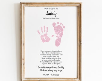 May include: Pink handprint and footprint on a white background with the text "Walk alongside me daddy and hold my little hand."  The text continues with a poem about a child learning and growing. The poem ends with "So walk alongside me, Daddy. We have a long way to go."  The date "06.19.2022" and the name "OLIVIA" are printed below the poem.