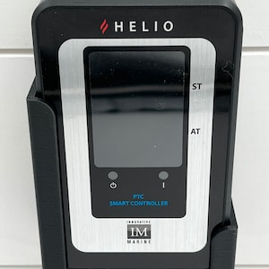May include: A black and silver smart controller with a digital display and the text "PTC SMART CONTROLLER" and "INNOVATIVE IM MARINE".
