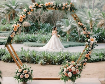 May include: A hexagonal wooden wedding arch decorated with peach and white flowers, greenery, and leaves. A bride in a white wedding dress walks towards the arch.