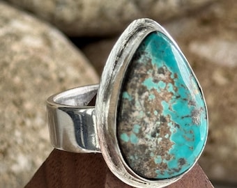 Sterling Silver and bezel set Turquoise . Size 6 3/4