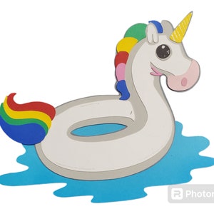 May include: A white unicorn inflatable pool float with a rainbow tail and a yellow horn. The float is in a blue pool of water.