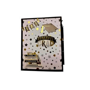 May include: A rectangular greeting card with a white background featuring black, silver, and gold stars. It displays a gold banner with the text YAY, a graduation cap, the text CONGRATS GRAD, and a stack of books labeled HISTORY and CALCULUS.
