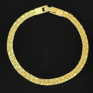 Vintage 7,5" goudkleurige platte nuggetarmband