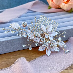 Exquisite rose gold and silver finish hair accessory, featuring lustrous flowers and leaves - a perfect adornment for weddings, proms, and special occasions.