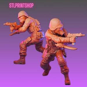 May include: Two figures of soldiers in combat gear, including helmets, gas masks, and tactical vests. Each figure holds a weapon, one a submachine gun and the other a knife. The figures are in a dynamic pose, suggesting action. The text "STLPRINTSHOP" is at the top.