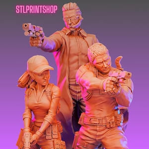 May include: Three orange-toned figurines of armed figures. The tallest figure wears a long coat and headset, aiming a pistol. The other two figures are also holding pistols, one wearing a cap and the other in tactical gear. The text "STLPRINTSHOP" is visible.