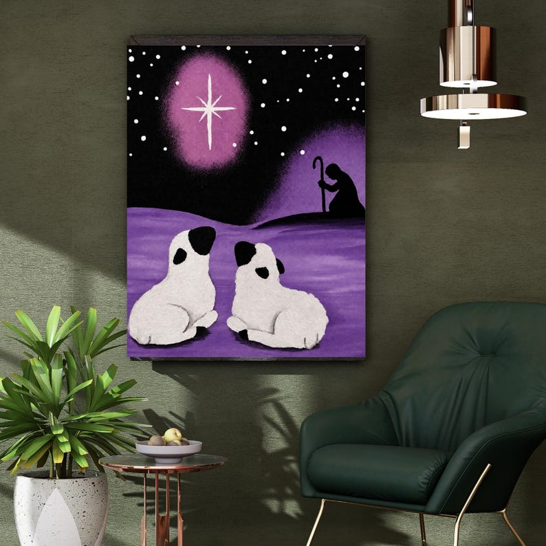 May include: A rectangular wall art print featuring a purple and black night scene with two white sheep with black ears and faces resting in the foreground. A bright white star glows in the sky above, and a silhouette of a shepherd with a staff is visible.