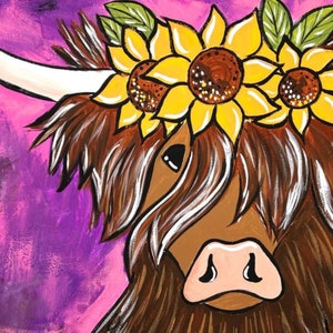 May include: A brown and white Highland cow with long, shaggy hair wearing a crown of yellow sunflowers with green leaves.