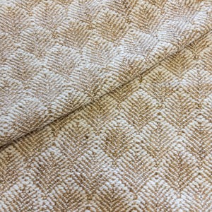 May include: Close-up of a woven fabric with a textured, diamond-patterned design. The fabric features a combination of beige and off-white threads, creating a neutral color palette. The weave is visible, showing the texture of the material.