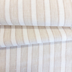 May include: A textile fabric featuring a repeating pattern of vertical stripes in alternating shades of beige and white. The design includes thin, textured, dotted lines running parallel to the wider solid stripes, creating a consistent linear visual.