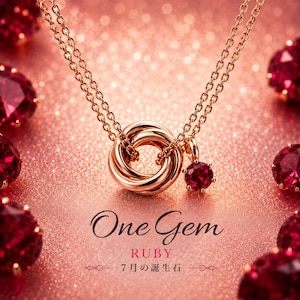 May include: A rose gold necklace featuring an interlocking triple ring pendant and a single round-cut ruby charm. The text One Gem RUBY 7月の誕生石 is printed below the jewelry. The piece is surrounded by several loose, faceted red rubies.